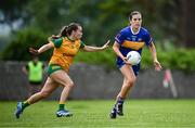21 June 2025; Anna Rose Kennedy of Tipperary in action against Blaithnaid McLaughlin of Donegal during the TG4 All-Ireland Ladies Football Senior Championship Group 1 match between Tipperary and Donegal at Canon Hayes Park in Bansha, Tipperary. Photo by Seb Daly/Sportsfile