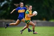 21 June 2025; Shauna McFadden of Donegal in action against Sarah English of Tipperary during the TG4 All-Ireland Ladies Football Senior Championship Group 1 match between Tipperary and Donegal at Canon Hayes Park in Bansha, Tipperary. Photo by Seb Daly/Sportsfile