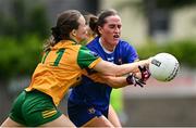 21 June 2025; Laura Morrissey of Tipperary in action against Katie Dowds of Donegal during the TG4 All-Ireland Ladies Football Senior Championship Group 1 match between Tipperary and Donegal at Canon Hayes Park in Bansha, Tipperary. Photo by Seb Daly/Sportsfile
