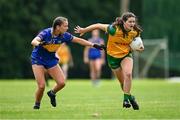 21 June 2025; Niamh Boyle of Donegal in action against Nora Martin of Tipperary during the TG4 All-Ireland Ladies Football Senior Championship Group 1 match between Tipperary and Donegal at Canon Hayes Park in Bansha, Tipperary. Photo by Seb Daly/Sportsfile