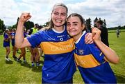 21 June 2025; Tipperary players Maria Curley, left, and Sarah English celebrate after their side's victory in the TG4 All-Ireland Ladies Football Senior Championship Group 1 match between Tipperary and Donegal at Canon Hayes Park in Bansha, Tipperary. Photo by Seb Daly/Sportsfile