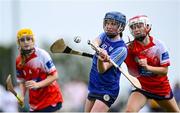 21 June 2025; Nicole Griffin of Kilmaley in action against Sive Finnerty of Mungret St Paul's during the John West Féile na nGael Camogie and Hurling National Finals match between Kilmaley and Mungret St Paul's at Hailo Tiles Wexford GAA Centre of Excellence in Ferns, Wexford. Photo by Shauna Clinton/Sportsfile