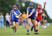 21 June 2025; Jasmine Kuczmyjiw-Jackson of Kilmaley in action against Jasmine Foster of Mungret St Paul's during the John West Féile na nGael Camogie and Hurling National Finals match between Kilmaley and Mungret St Paul's at Halo Tiles Wexford GAA Centre of Excellence in Ferns, Wexford. Photo by Shauna Clinton/Sportsfile