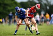 21 June 2025; Jasmine Kuczmyjiw-Jackson of Kilmaley in action against Sive Finnerty of Mungret St Paul's during the John West Féile na nGael Camogie and Hurling National Finals match between Kilmaley and Mungret St Paul's at Hailo Tiles Wexford GAA Centre of Excellence in Ferns, Wexford. Photo by Shauna Clinton/Sportsfile