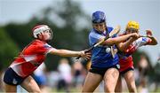 21 June 2025; Jasmine Kuczmyjiw-Jackson of Kilmaley in action against Sive Finnerty of Mungret St Paul's during the John West Féile na nGael Camogie and Hurling National Finals match between Kilmaley and Mungret St Paul's at Hailo Tiles Wexford GAA Centre of Excellence in Ferns, Wexford. Photo by Shauna Clinton/Sportsfile