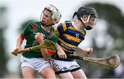 21 June 2025; Cian Loughnane of Michael Cusacks in action against Ronan O'Dwyer of Cashel King Cormacs during the John West Féile na nGael Camogie and Hurling National Finals at Hailo Tiles Wexford GAA Centre of Excellence in Ferns, Wexford. Photo by Shauna Clinton/Sportsfile