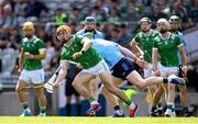 21 June 2025; Adam English of Limerick in action against Conor McHugh of Dublin during the GAA Hurling All-Ireland Senior Championship quarter-final match between Dublin and Limerick at Croke Park in Dublin. Photo by Ramsey Cardy/Sportsfile