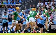 21 June 2025; Paddy Doyle of Dublin gets a pass away under pressure from Limerick players Adam English, 8, and William O'Donoghue during the GAA Hurling All-Ireland Senior Championship quarter-final match between Dublin and Limerick at Croke Park in Dublin. Photo by Ramsey Cardy/Sportsfile