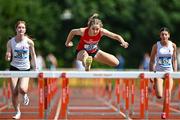 21 June 2025; Rachel Treacy of High Cross College Tuam, representing Connacht, centre, on her way to winning the girls 80m hurdles during the 123.ie Irish Schools Athletics Association Tailteann Games at SETU Campus in Carlow. Photo by Sam Barnes/Sportsfile