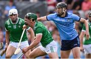 21 June 2025; Sean Finn of Limerick in action against Ronan Hayes of Dublin during the GAA Hurling All-Ireland Senior Championship quarter-final match between Dublin and Limerick at Croke Park in Dublin. Photo by Ramsey Cardy/Sportsfile