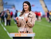 21 June 2025; Emer Gallagher of TG4 displays the name of Cork during the draw for the TG4 All-Ireland Ladies Football Senior Championship Quarter-Finals after the TG4 All-Ireland Ladies Football Senior Championship Group 2 match between Mayo and Cork at Hastings Insurance MacHale Park in Castlebar, Mayo. Photo by Piaras Ó Mídheach/Sportsfile