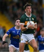 21 June 2025; David Clifford of Kerry in action against Niall Carolan of Cavan during the GAA Football All-Ireland Senior Championship preliminary quarter-final match between Kerry and Cavan at Fitzgerald Stadium in Killarney, Kerry. Photo by Brendan Moran/Sportsfile