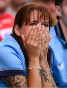 21 June 2025; A Dublin supporter watches on late in the GAA Hurling All-Ireland Senior Championship quarter-final match between Dublin and Limerick at Croke Park in Dublin. Photo by Ramsey Cardy/Sportsfile