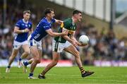 21 June 2025; Seán O'Shea of Kerry is tackled by Brian O'Connell of Cavan during the GAA Football All-Ireland Senior Championship preliminary quarter-final match between Kerry and Cavan at Fitzgerald Stadium in Killarney, Kerry. Photo by Brendan Moran/Sportsfile