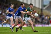 21 June 2025; Seán O'Shea of Kerry is tackled by Brian O'Connell of Cavan during the GAA Football All-Ireland Senior Championship preliminary quarter-final match between Kerry and Cavan at Fitzgerald Stadium in Killarney, Kerry. Photo by Brendan Moran/Sportsfile