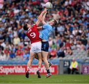 21 June 2025; Peadar Ó Cofaigh Byrne of Dublin and Colm O'Callaghan of Cork during the GAA Football All-Ireland Senior Championship preliminary quarter-final match between Dublin and Cork at Croke Park in Dublin. Photo by Ramsey Cardy/Sportsfile