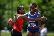 21 June 2025; Destiny Lawal of Castletroy College, representing Munster, right, celebrates with Michelle Nnadi of Dominican College Taylors Hill, representing Connacht, after winning the women's 100m during the 123.ie Irish Schools Athletics Association Tailteann Games at SETU Campus in Carlow. Photo by Sam Barnes/Sportsfile