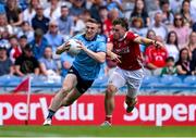 21 June 2025; Paddy Small of Dublin in action against Neil Lordan of Cork during the GAA Football All-Ireland Senior Championship preliminary quarter-final match between Dublin and Cork at Croke Park in Dublin. Photo by Daire Brennan/Sportsfile