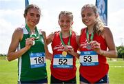 21 June 2025; Girls 3000m medallists, Freya Renton of SH Westport, representing Connacht, centre, gold, Emma Hickey of St Mary's New Ross, representing Leinster, left, silver, and Holly Renton of SH Westport, representing Connacht, right, bronze, during the 123.ie Irish Schools Athletics Association Tailteann Games at SETU Campus in Carlow. Photo by Sam Barnes/Sportsfile