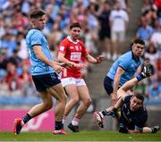 21 June 2025; Dublin goalkeeper Stephen Cluxton  and David Byrne watch on as Chris Óg Jones of Cork scores his side's first goal during the GAA Football All-Ireland Senior Championship preliminary quarter-final match between Dublin and Cork at Croke Park in Dublin. Photo by Ramsey Cardy/Sportsfile