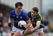 21 June 2025; Gerard Smith of Cavan is tackled by Conor Geaney of Kerry during the GAA Football All-Ireland Senior Championship preliminary quarter-final match between Kerry and Cavan at Fitzgerald Stadium in Killarney, Kerry. Photo by Brendan Moran/Sportsfile
