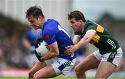 21 June 2025; Gerard Smith of Cavan is tackled by Conor Geaney of Kerry during the GAA Football All-Ireland Senior Championship preliminary quarter-final match between Kerry and Cavan at Fitzgerald Stadium in Killarney, Kerry. Photo by Brendan Moran/Sportsfile