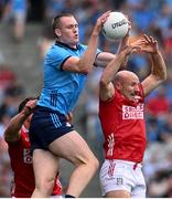21 June 2025; Peadar Ó Cofaigh Byrne of Dublin in action against Brian O'Driscoll of Cork during the GAA Football All-Ireland Senior Championship preliminary quarter-final match between Dublin and Cork at Croke Park in Dublin. Photo by Ramsey Cardy/Sportsfile