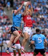 21 June 2025; Peadar Ó Cofaigh Byrne of Dublin in action against Brian O' Driscoll of Cork during the GAA Football All-Ireland Senior Championship preliminary quarter-final match between Dublin and Cork at Croke Park in Dublin. Photo by Ramsey Cardy/Sportsfile