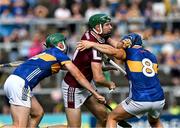21 June 2025; Cathal Mannion of Galway is tackled by Robert Doyle and Willie Connors of Tipperary during the GAA Hurling All-Ireland Senior Championship quarter-final match between Galway and Tipperary at TUS Gaelic Grounds in Limerick. Photo by Ray McManus/Sportsfile
