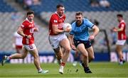 21 June 2025; Seán Walsh  of Cork in action against Sean MacMahon of Dublin during the GAA Football All-Ireland Senior Championship preliminary quarter-final match between Dublin and Cork at Croke Park in Dublin. Photo by Ramsey Cardy/Sportsfile