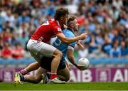 21 June 2025; Paddy Small of Dublin in action against Neil Lordan of Cork during the GAA Football All-Ireland Senior Championship preliminary quarter-final match between Dublin and Cork at Croke Park in Dublin. Photo by Daire Brennan/Sportsfile