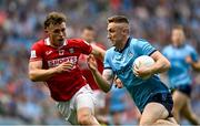 21 June 2025; Paddy Small of Dublin in action against Neil Lordan of Cork during the GAA Football All-Ireland Senior Championship preliminary quarter-final match between Dublin and Cork at Croke Park in Dublin. Photo by Daire Brennan/Sportsfile