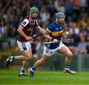 21 June 2025; Willie Connors of Tipperary in action against David Burke of Galway during the GAA Hurling All-Ireland Senior Championship quarter-final match between Galway and Tipperary at TUS Gaelic Grounds in Limerick. Photo by Ray McManus/Sportsfile