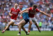 21 June 2025; Paddy Small of Dublin in action against Neil Lordan of Cork during the GAA Football All-Ireland Senior Championship preliminary quarter-final match between Dublin and Cork at Croke Park in Dublin. Photo by Daire Brennan/Sportsfile