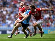 21 June 2025; Paddy Small of Dublin in action against Neil Lordan of Cork during the GAA Football All-Ireland Senior Championship preliminary quarter-final match between Dublin and Cork at Croke Park in Dublin. Photo by Daire Brennan/Sportsfile