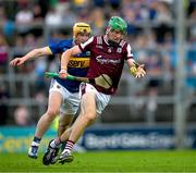 21 June 2025; Cianan Fahy of Galway is tackled by Jake Morris of Tipperary during the GAA Hurling All-Ireland Senior Championship quarter-final match between Galway and Tipperary at TUS Gaelic Grounds in Limerick. Photo by Ray McManus/Sportsfile