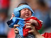 21 June 2025; Dublin and Cork supporter Cillian Brennan, aged 9 weeks, from Goatstown, Co Dublin, with family in Midleton, Co Cork, watches on during the GAA Football All-Ireland Senior Championship preliminary quarter-final match between Dublin and Cork at Croke Park in Dublin. Photo by Daire Brennan/Sportsfile