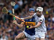21 June 2025; Galway goalkeeper Darach Fahy is tackled by John McGrath of Tipperary during the GAA Hurling All-Ireland Senior Championship quarter-final match between Galway and Tipperary at TUS Gaelic Grounds in Limerick. Photo by Ray McManus/Sportsfile