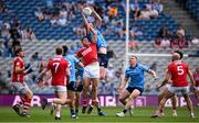 21 June 2025; Peadar Ó Cofaigh Byrne of Dublin and Colm O'Callaghan of Cork during the GAA Football All-Ireland Senior Championship preliminary quarter-final match between Dublin and Cork at Croke Park in Dublin. Photo by Ramsey Cardy/Sportsfile