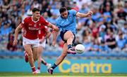 21 June 2025; Brian Howard of Dublin scores his side's first goal despite the attention of Sean McDonnell of Cork during the GAA Football All-Ireland Senior Championship preliminary quarter-final match between Dublin and Cork at Croke Park in Dublin. Photo by Ramsey Cardy/Sportsfile