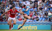 21 June 2025; Brian Howard of Dublin scores his side's first goal despite the attention of Sean McDonnell of Cork during the GAA Football All-Ireland Senior Championship preliminary quarter-final match between Dublin and Cork at Croke Park in Dublin. Photo by Ramsey Cardy/Sportsfile