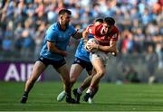 21 June 2025; Chris Óg Jones of Cork in action against Sean MacMahon of Dublin during the GAA Football All-Ireland Senior Championship preliminary quarter-final match between Dublin and Cork at Croke Park in Dublin. Photo by Daire Brennan/Sportsfile