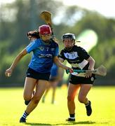 21 June 2025; Aoibhinn Donnelly of Kilmaley in action against Hannah Hughes of Turloughmore during the Camogie Division 1 Final match between Turloughmore and Kilmaley during the John West Féile na nGael Camogie and Hurling National Finals at Halo Tiles Wexford GAA Centre of Excellence in Ferns, Wexford. Photo by Shauna Clinton/Sportsfile