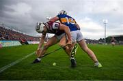 21 June 2025; Daithí Burke of Galway is tackled by Darragh McCarthy of Tipperary during the GAA Hurling All-Ireland Senior Championship quarter-final match between Galway and Tipperary at TUS Gaelic Grounds in Limerick. Photo by Ray McManus/Sportsfile