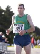 18 September 2004; Gerard Heery, 3rd place, crosses the finish during the adidas BHAA Dublin half-marathon. Phoenix Park, Dublin. Picture credit; Brian Lawless / SPORTSFILE