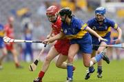 19 September 2004; Elaine Burke, Cork, in action against Ciara Gaynor, Tipperary. Foras na Gaeilge Senior Camogie Championship All-Ireland Final, Tipperary v Cork, Croke Park, Dublin. Picture credit; Ray McManus / SPORTSFILE