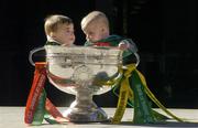 24 September 2004; Six month old Jack Ward, wearing the Kerry jersey, and Ella May Whelan, six and a half months, wearing the Mayo jersey, at a photocall with the Sam Maguire Cup ahead of the Bank of Ireland Senior Football Championship final. Bank of Ireland Head Office, Baggot Street, Dublin. Picture credit; Ray McManus / SPORTSFILE