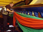 25 September 2004; Linda Bevort pins the Mayo colours to the stairs of the Mayo team Hotel, CityWest Hotel, Saggart, Co. Dublin. Picture credit; Damien Eagers / SPORTSFILE