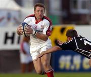 25 September 2004; Jonathan Bell, Ulster, is tackled by Adrian Durston, Neath / Swansea Ospreys. Celtic League 2004-2005, Ulster v Neath / Swansea Ospreys, Ravenhill, Belfast. Picture credit; Matt Browne / SPORTSFILE