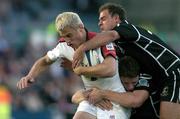 25 September 2004; Tommy Bowe, Ulster, is tackled by Adrian Durston and David Bishop, Neath / Swansea Ospreys. Celtic League 2004-2005, Ulster v Neath / Swansea Ospreys, Ravenhill, Belfast. Picture credit; Matt Browne / SPORTSFILE